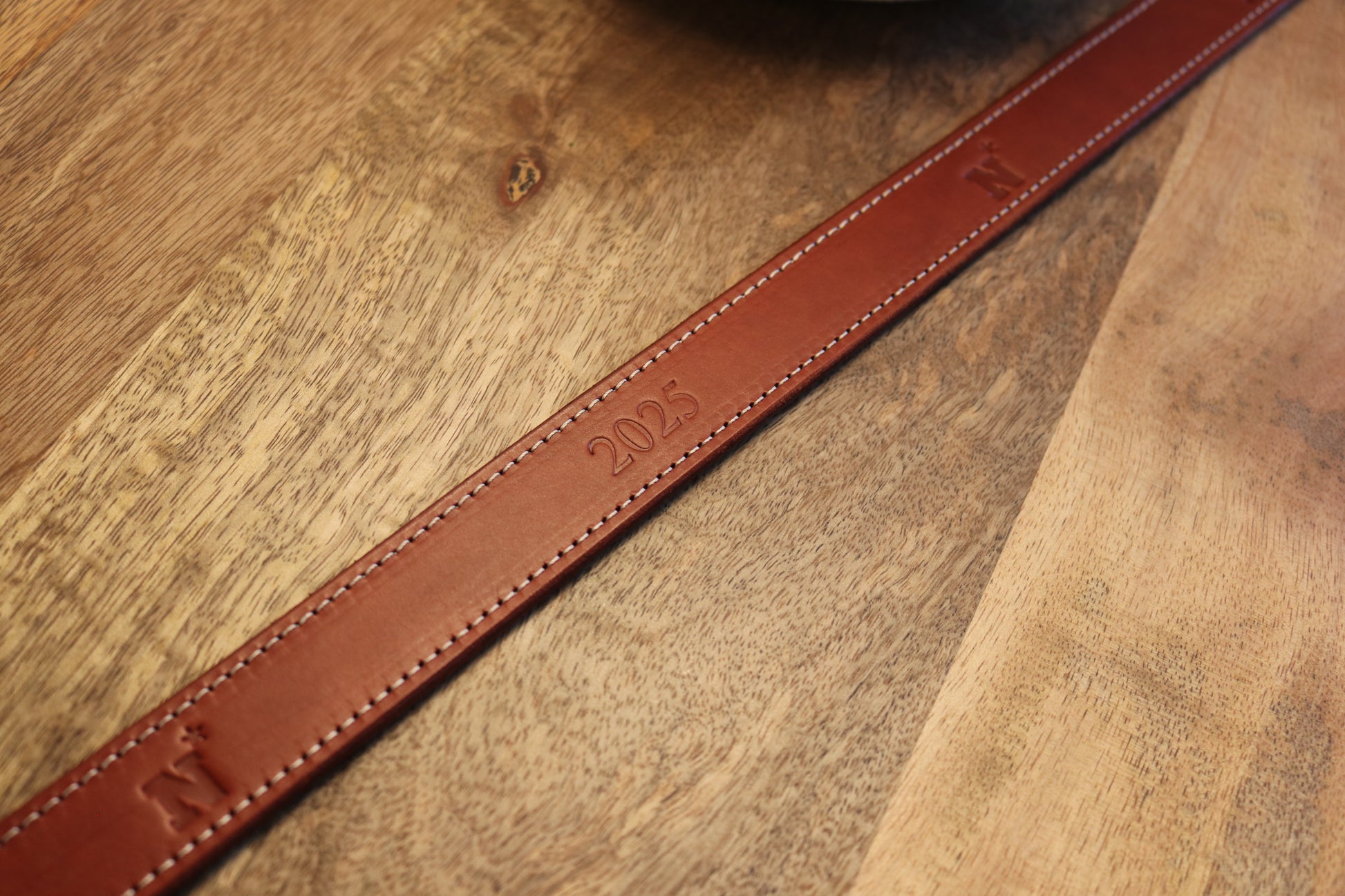 Handcrafted leather belt with Navy Midshipmen logo debossed. Option to include Naval Academy Class Year.
