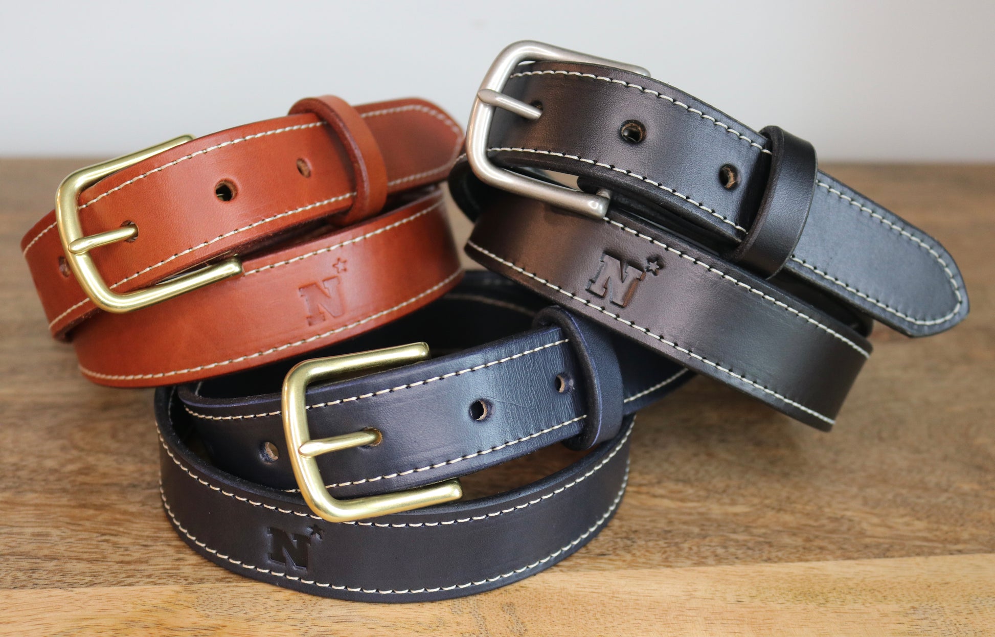 Handcrafted leather belt with Navy Midshipmen logo debossed
