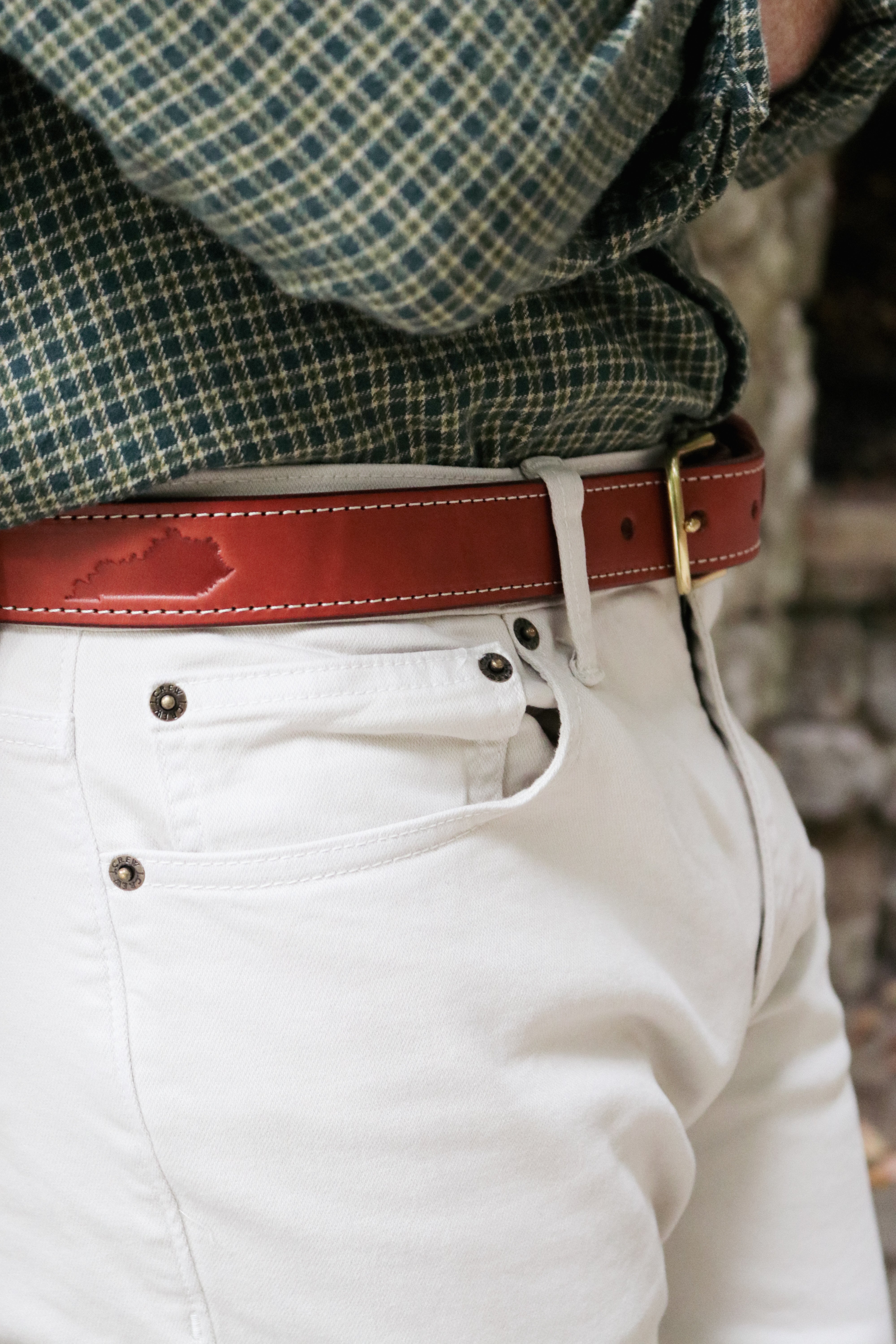Brown full-grain leather belt handcrafted in Matthews, NC and debossed with the Kentucky state outline.